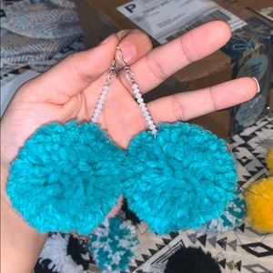 teal pom pom earrings